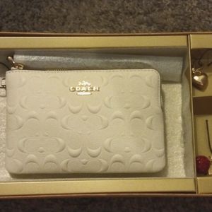 Boxed Corner Zip Wristlet In Signature Leather w/ 2 detachable charms